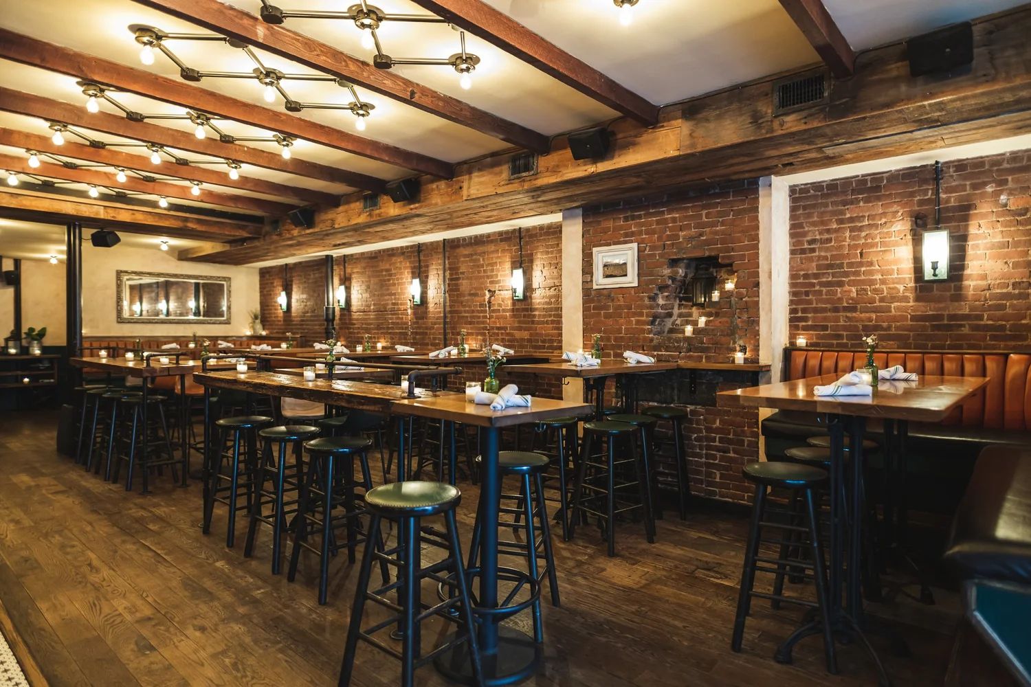 Jackdaw's dining room — exposed brick and warm lighting